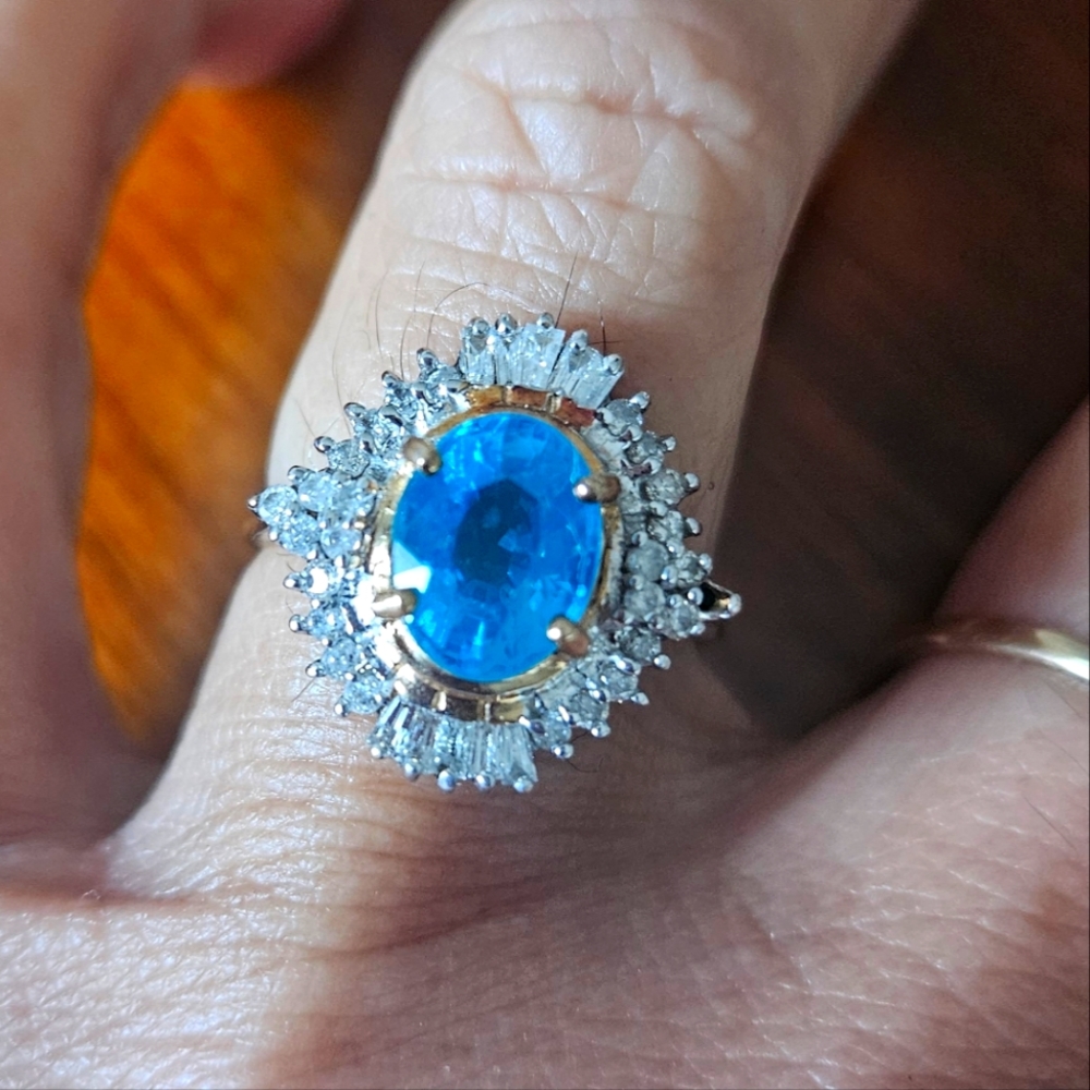 14kt ring with aquamarine and diamonds.